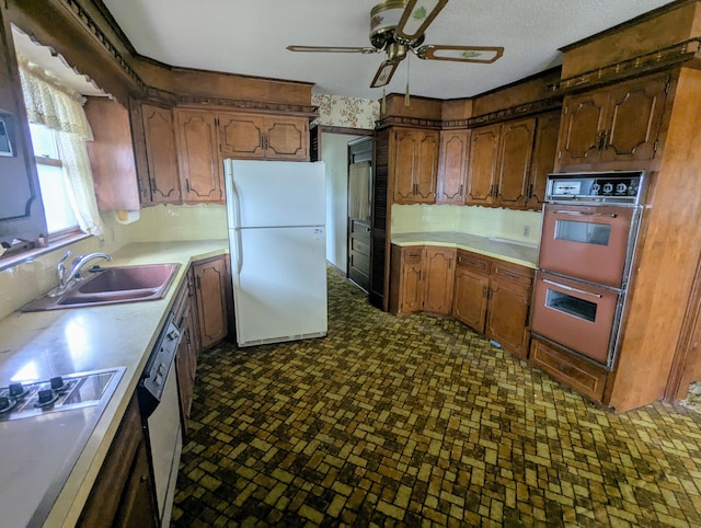 55 Cricket Hill Ln, Lampe, MO 65681 - kitchen with white appliances, ceiling fan, tasteful backsplash, light countertops, and brick patterned flooring