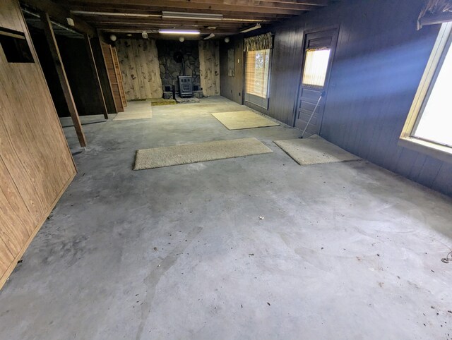 55 Cricket Hill Ln, Lampe, MO 65681 - basement with a wood stove and wooden walls