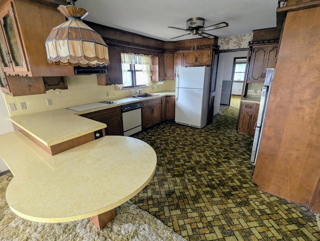 55 Cricket Hill Ln, Lampe, MO 65681 - kitchen with white appliances, a peninsula, light countertops, backsplash, and a ceiling fan