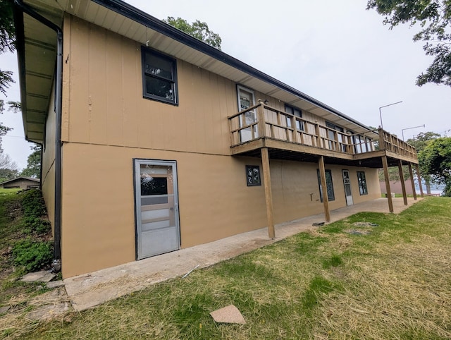 55 Cricket Hill Ln, Lampe, MO 65681 - back of property featuring a lawn, a patio, and a deck