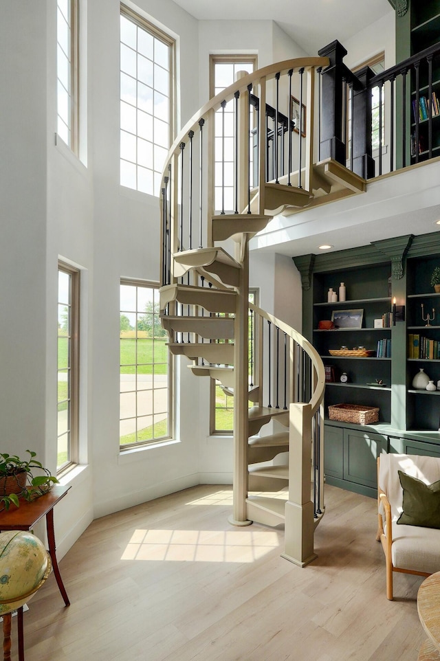 1373 E River Oak Dr, Springfield, MO 65803 - stairway with a high ceiling, wood finished floors, and plenty of natural light