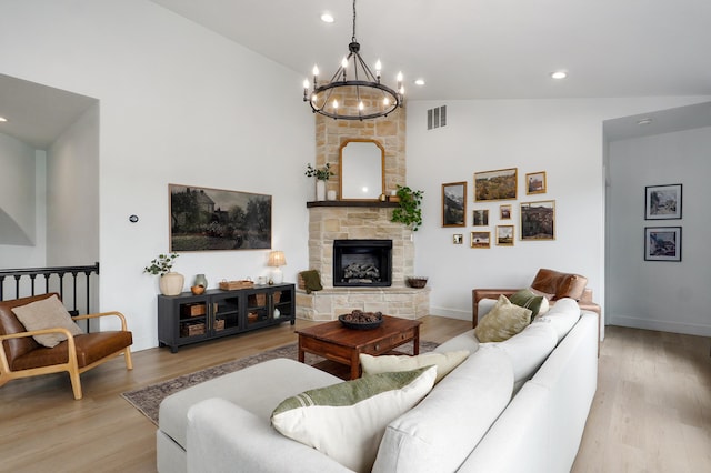 1373 E River Oak Dr, Springfield, MO 65803 - living area with a chandelier, light wood-style floors, high vaulted ceiling, a fireplace, and recessed lighting
