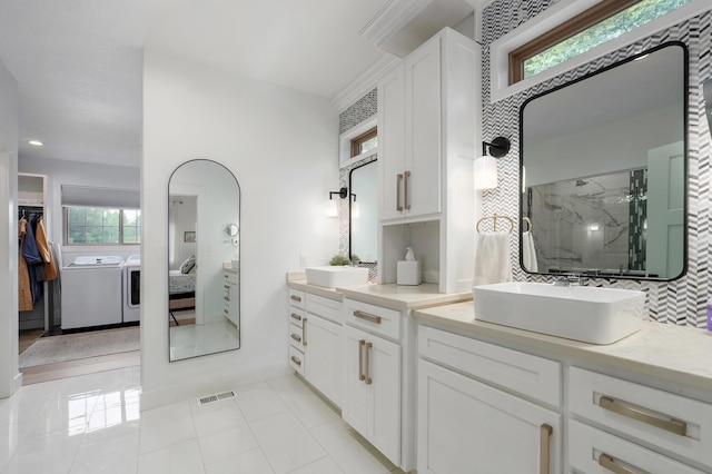 1373 E River Oak Dr, Springfield, MO 65803 - ensuite bathroom with separate washer and dryer, a marble finish shower, healthy amount of natural light, vanity, and recessed lighting