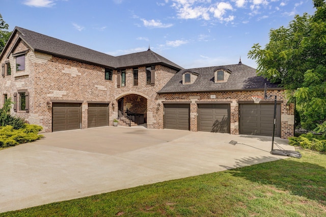 1373 E River Oak Dr, Springfield, MO 65803 - french country inspired facade with concrete driveway, brick siding, and roof with shingles