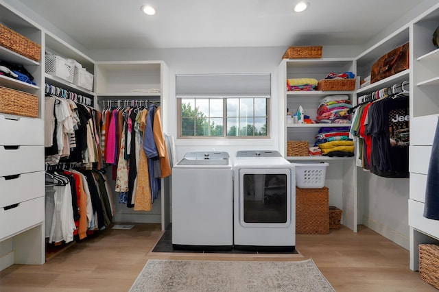 1373 E River Oak Dr, Springfield, MO 65803 - laundry room with washing machine and clothes dryer, light wood-type flooring, and recessed lighting