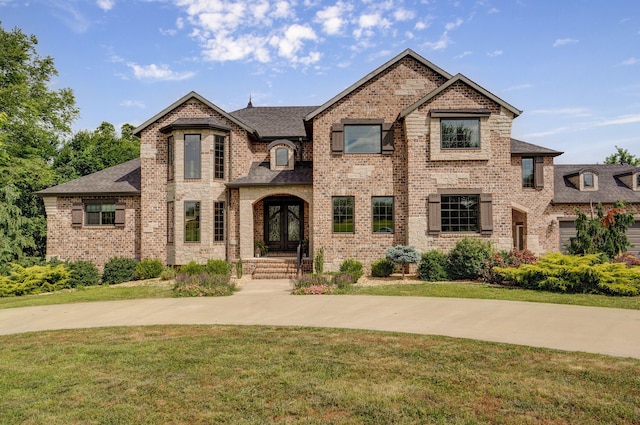 1373 E River Oak Dr, Springfield, MO 65803 - french country inspired facade featuring a front lawn, brick siding, and a shingled roof