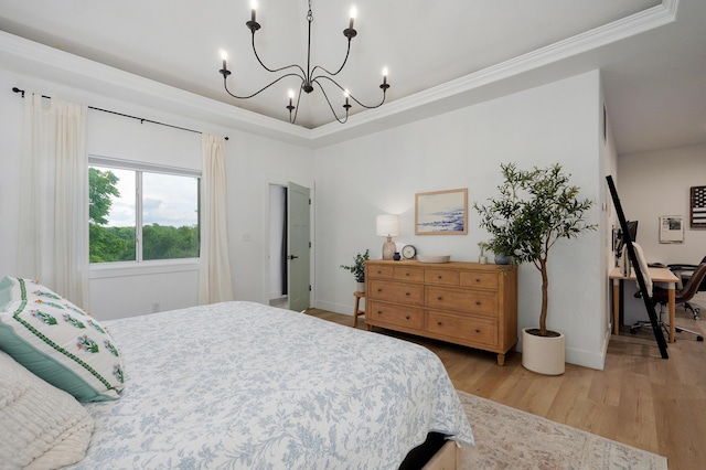 1373 E River Oak Dr, Springfield, MO 65803 - bedroom featuring a chandelier, light wood-style floors, ornamental molding, and a tray ceiling