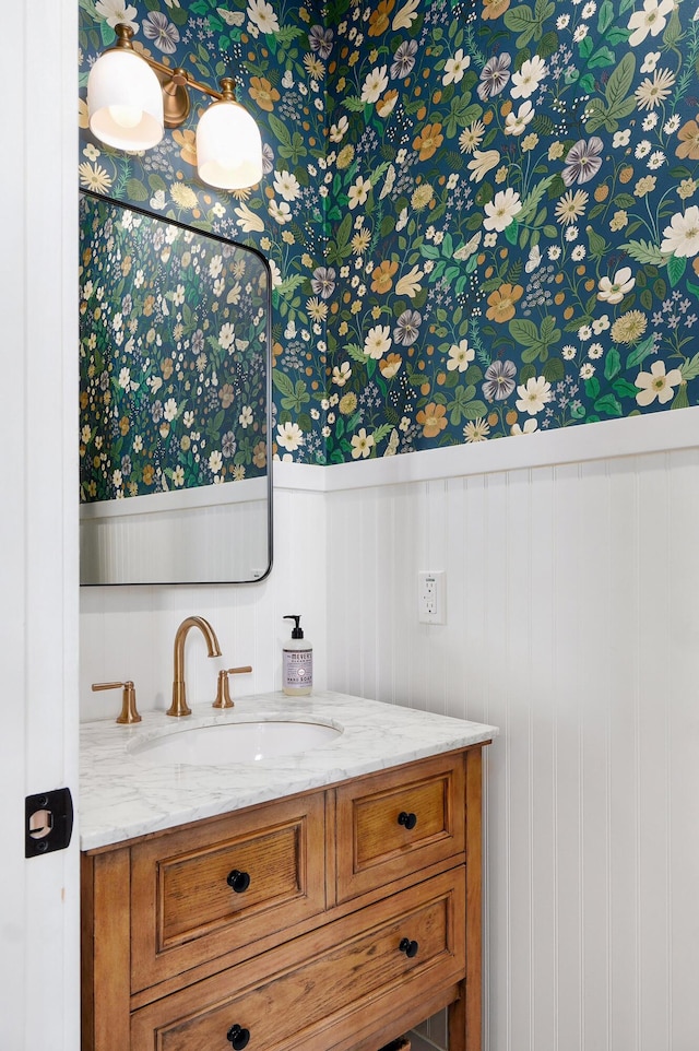1373 E River Oak Dr, Springfield, MO 65803 - bathroom featuring wallpapered walls, vanity, and a wainscoted wall
