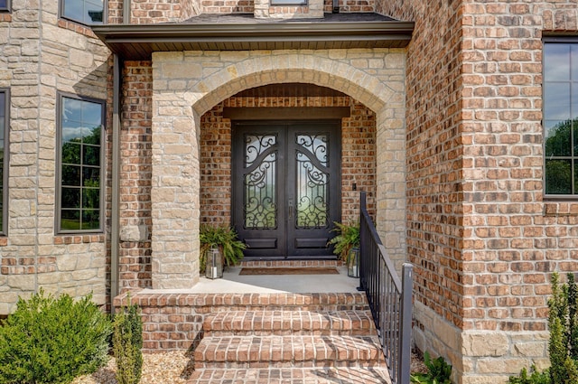 1373 E River Oak Dr, Springfield, MO 65803 - view of exterior entry featuring french doors and brick siding