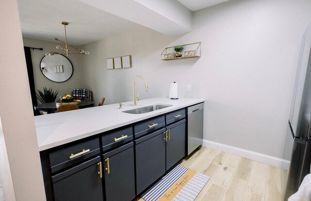 158 Troon Dr Unit 5, Branson, MO 65616 - kitchen with dishwasher, light countertops, light wood-style floors, and a peninsula
