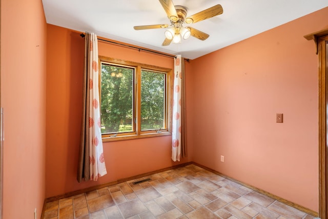 401 N Niangua Dr, Nixa, MO 65714 - spare room with a ceiling fan and light stone finish flooring