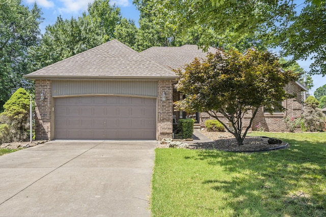 401 N Niangua Dr, Nixa, MO 65714 - view of front of home featuring driveway, an attached garage, a front lawn, and brick siding