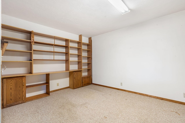 401 N Niangua Dr, Nixa, MO 65714 - empty room featuring built in desk and light carpet
