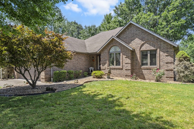 401 N Niangua Dr, Nixa, MO 65714 - view of front of property with brick siding, driveway, a front yard, a garage, and a shingled roof