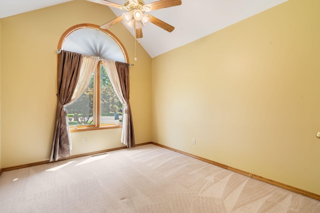 401 N Niangua Dr, Nixa, MO 65714 - spare room featuring vaulted ceiling, a ceiling fan, and light carpet