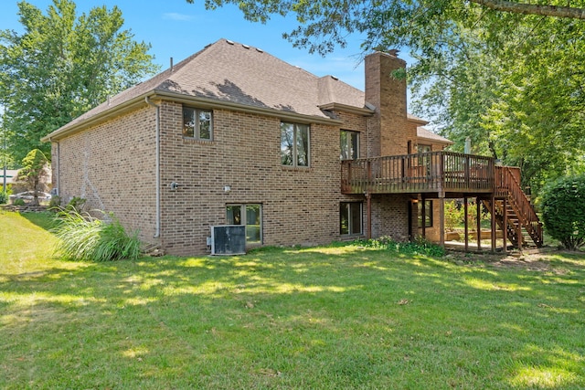 401 N Niangua Dr, Nixa, MO 65714 - rear view of house with brick siding, a deck, stairway, a chimney, and a yard