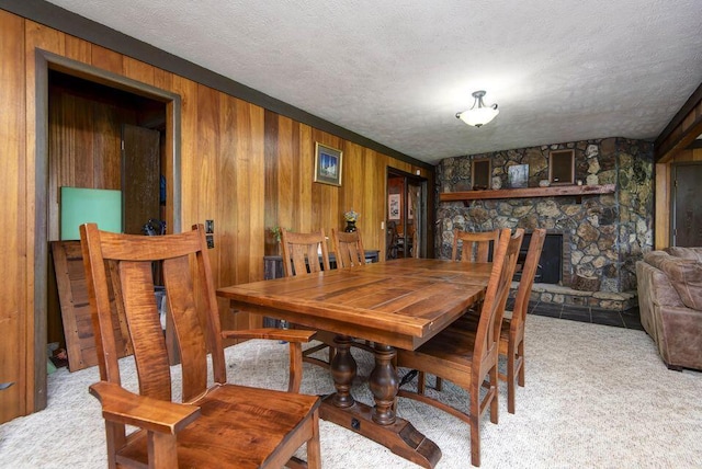 637 State Highway Kk, Cedar Creek, MO 65627 - carpeted dining space with wooden walls and a textured ceiling