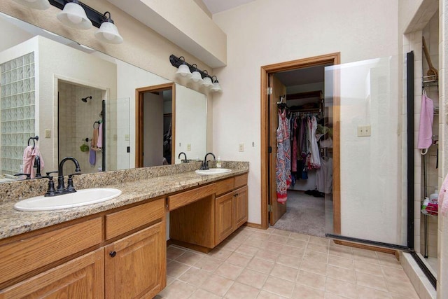 637 State Highway Kk, Cedar Creek, MO 65627 - full bath featuring a walk in closet, a stall shower, double vanity, and tile patterned floors