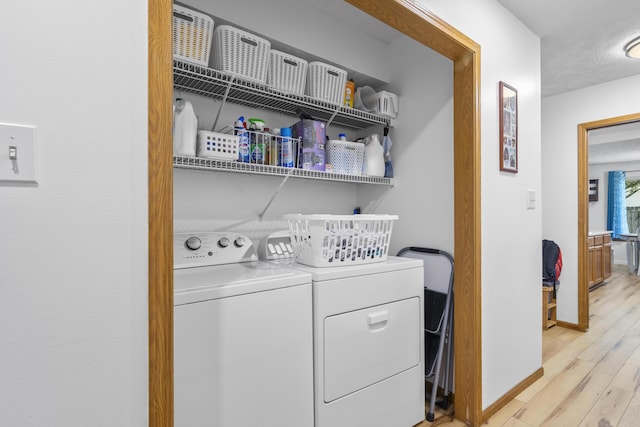 4105 S Oak Ave, Springfield, MO 65804 - washroom featuring washer and clothes dryer and light wood finished floors