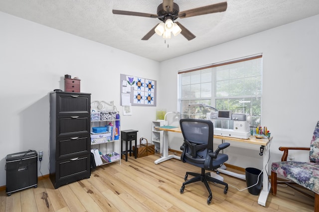 4105 S Oak Ave, Springfield, MO 65804 - home office with light wood-style floors, ceiling fan, and a textured ceiling