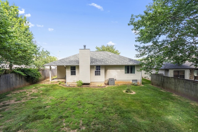 4105 S Oak Ave, Springfield, MO 65804 - back of house with a fenced backyard, a chimney, and a shingled roof