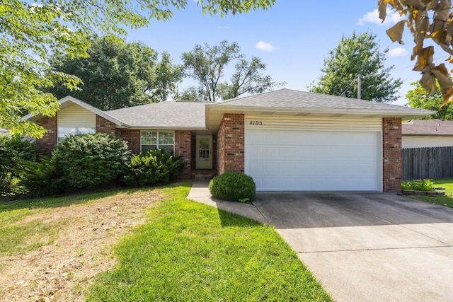 4105 S Oak Ave, Springfield, MO 65804 - single story home with brick siding, a garage, driveway, and roof with shingles