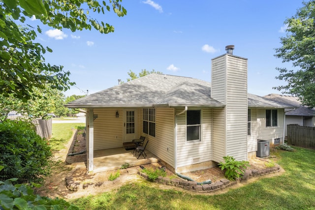 4105 S Oak Ave, Springfield, MO 65804 - back of property with a patio area, a chimney, and a shingled roof