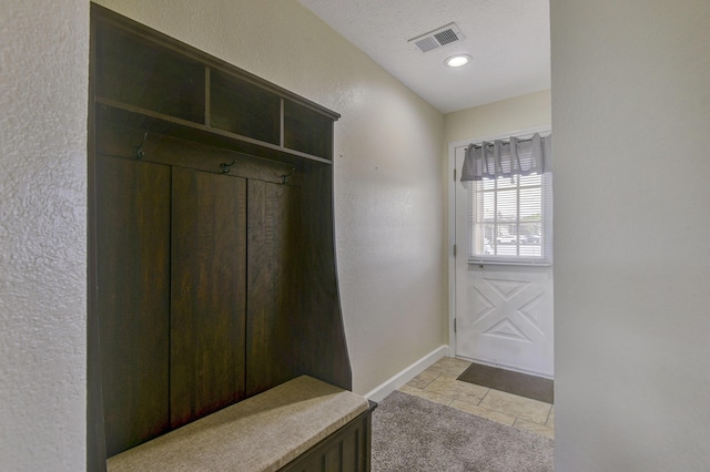 12 Scenic Ct Unit 10, Branson, MO 65616 - mudroom with light tile patterned floors and a textured wall