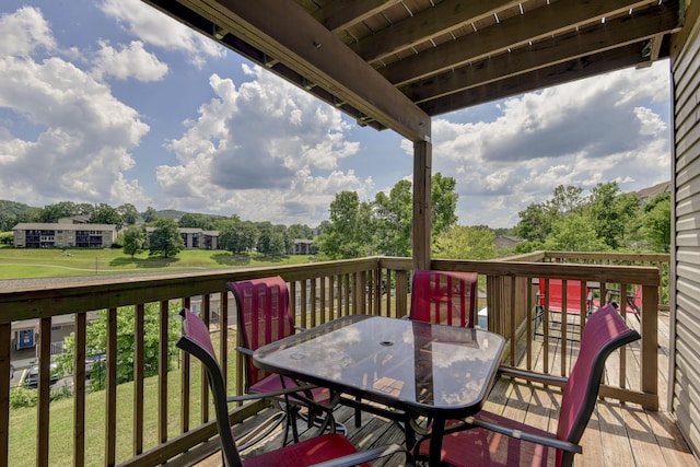 12 Scenic Ct Unit 10, Branson, MO 65616 - wooden terrace featuring outdoor dining area, view of scattered trees, and a lawn
