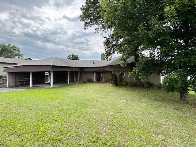9387 State Highway 13, Kimberling City, MO 65686 - back of house featuring a lawn