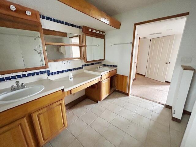 9387 State Highway 13, Kimberling City, MO 65686 - full bathroom with double vanity and tile patterned flooring
