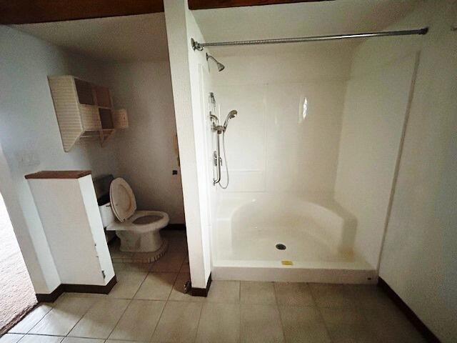 9387 State Highway 13, Kimberling City, MO 65686 - bathroom with a stall shower and tile patterned floors