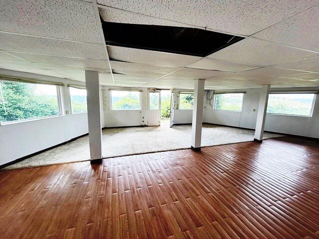 9387 State Highway 13, Kimberling City, MO 65686 - unfurnished room with wood-type flooring and plenty of natural light