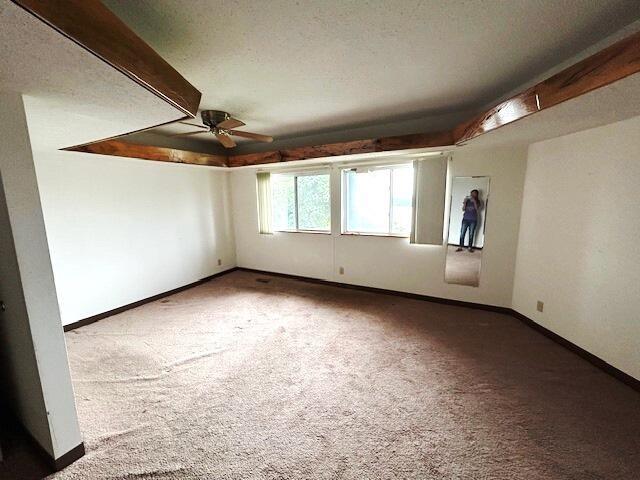 9387 State Highway 13, Kimberling City, MO 65686 - carpeted spare room featuring a ceiling fan and baseboards