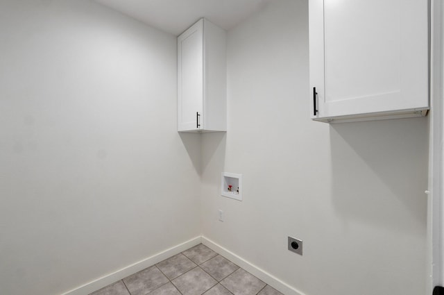 753 S Elm Rd, Marshfield, MO 65706 - laundry room featuring cabinet space, hookup for an electric dryer, hookup for a washing machine, and light tile patterned floors