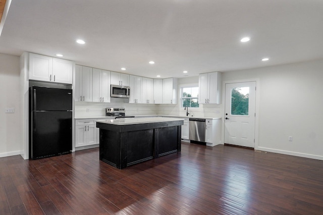 753 S Elm Rd, Marshfield, MO 65706 - kitchen featuring stainless steel appliances, light countertops, decorative backsplash, white cabinetry, and recessed lighting