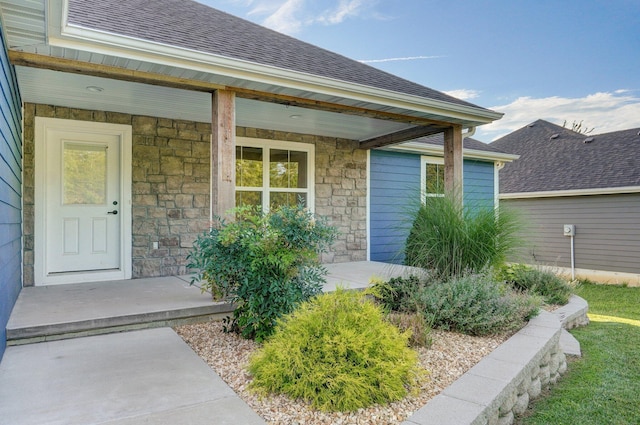 753 S Elm Rd, Marshfield, MO 65706 - entrance to property with stone siding, a shingled roof, and a porch