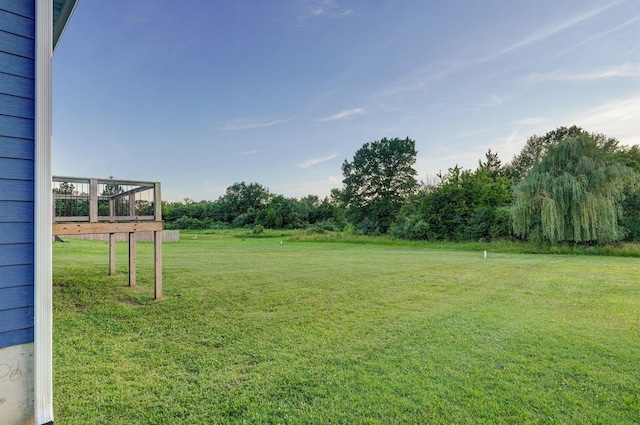 753 S Elm Rd, Marshfield, MO 65706 - view of green lawn with a wooden deck