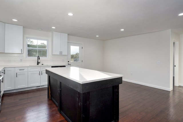 753 S Elm Rd, Marshfield, MO 65706 - kitchen with dark wood-type flooring, a center island, recessed lighting, backsplash, and white cabinets