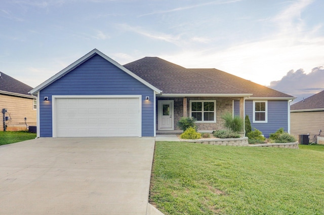 753 S Elm Rd, Marshfield, MO 65706 - ranch-style house featuring concrete driveway, a front yard, an attached garage, and stone siding