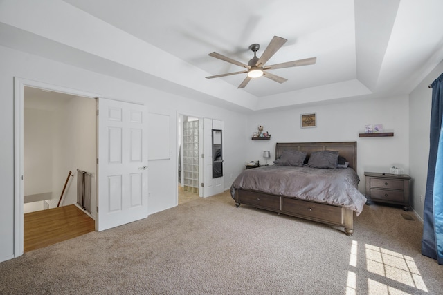 103 Fawn Trl, Neosho, MO 64850 - bedroom with carpet flooring, a raised ceiling, and a ceiling fan