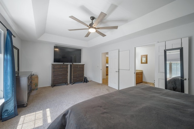 103 Fawn Trl, Neosho, MO 64850 - bedroom with a raised ceiling, light carpet, a ceiling fan, and connected bathroom