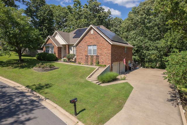 103 Fawn Trl, Neosho, MO 64850 - view of front of property featuring brick siding, concrete driveway, a garage, and a front lawn