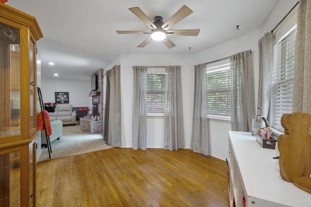 103 Fawn Trl, Neosho, MO 64850 - office area with light wood-type flooring, a ceiling fan, and a large fireplace