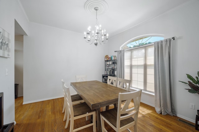 103 Fawn Trl, Neosho, MO 64850 - dining area featuring crown molding, a chandelier, and wood finished floors