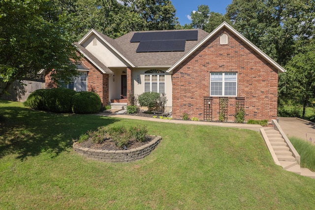 103 Fawn Trl, Neosho, MO 64850 - view of front facade with brick siding, roof mounted solar panels, roof with shingles, and stairs