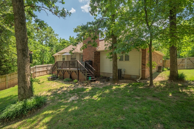 103 Fawn Trl, Neosho, MO 64850 - rear view of house featuring stairs, a deck, a fenced backyard, and a chimney