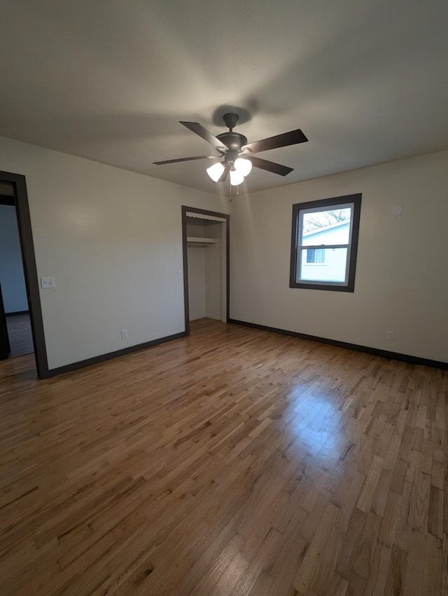 600 N Main St, Pleasant Hope, MO 65725 - unfurnished bedroom with wood finished floors, a closet, and a ceiling fan