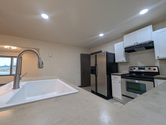 600 N Main St, Pleasant Hope, MO 65725 - kitchen featuring appliances with stainless steel finishes, under cabinet range hood, white cabinetry, backsplash, and recessed lighting