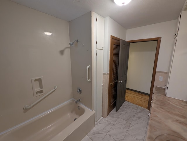 600 N Main St, Pleasant Hope, MO 65725 - bathroom featuring marble finish floors and washtub / shower combination